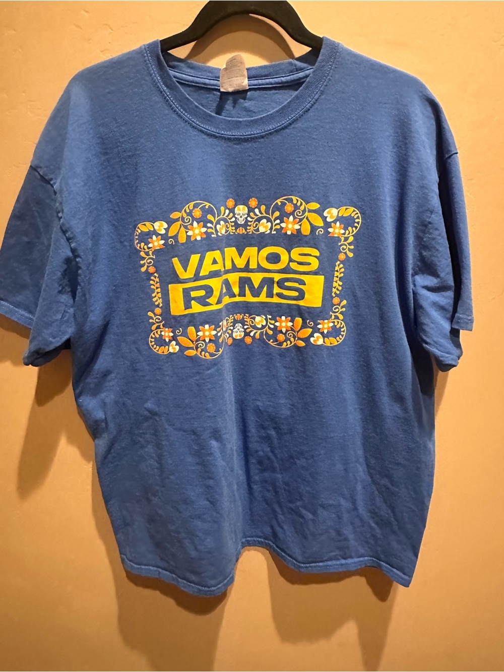 Port and Company Blue T‑Shirt with Yellow Floral 'VAMOS RAMS' Graphic